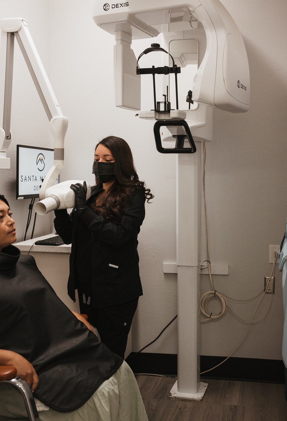 Digital Dental Imaging at Santa Martha Dental Santa Martha Dental team member using digital x-ray equipment on a patient in Ontario CA